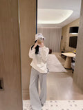 Chanel  A white long-sleeve cotton top 
