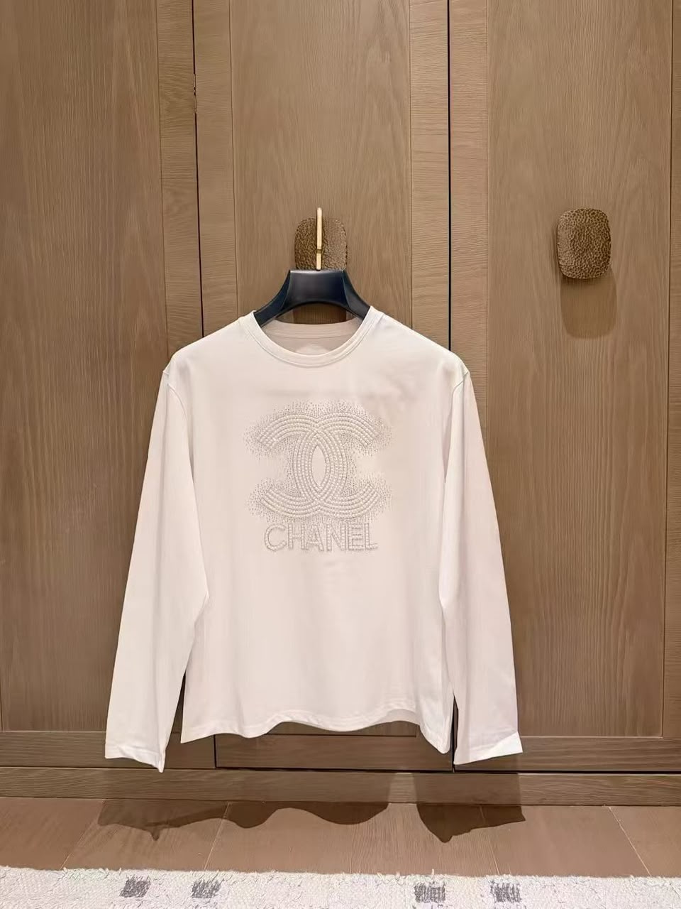 Chanel  A white long-sleeve cotton top 