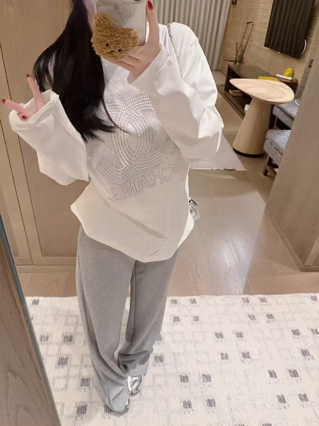 Chanel  A white long-sleeve cotton top 