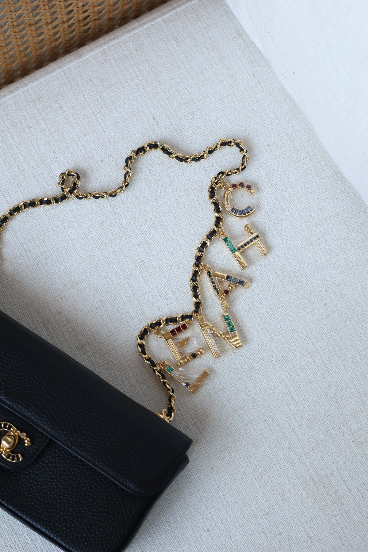 Chanel Black Leather Flap Bag with Gold Chain and Rhinestone Letter