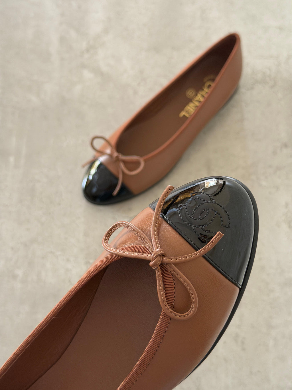 CHANEL Cap-Toe Bow Ballet Flats
