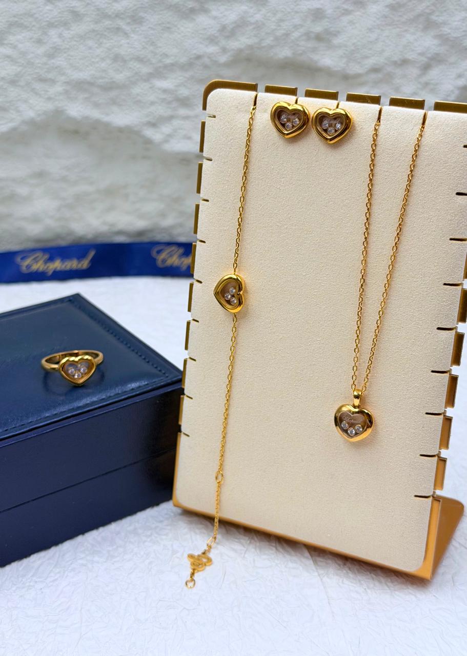 Chopard Happy Diamonds Happy Hearts Four-Piece Jewelry Set — -Tone Heart Necklace, Bracelet, Stud Earrings & Ring with Floating Stone