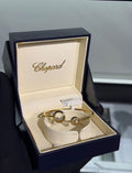 Chopard Happy Diamonds Open Cuff Bracelet — -Tone Metal with Asymmetric Round Motifs and Floating Stone Details.