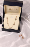 Chopard Happy Diamonds Happy Hearts Five-Heart Necklace — with Floating Diamond Details.