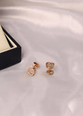Chopard Happy Diamonds Happy Hearts Stud Earrings —  Heart-Shaped Design with Floating Diamonds.