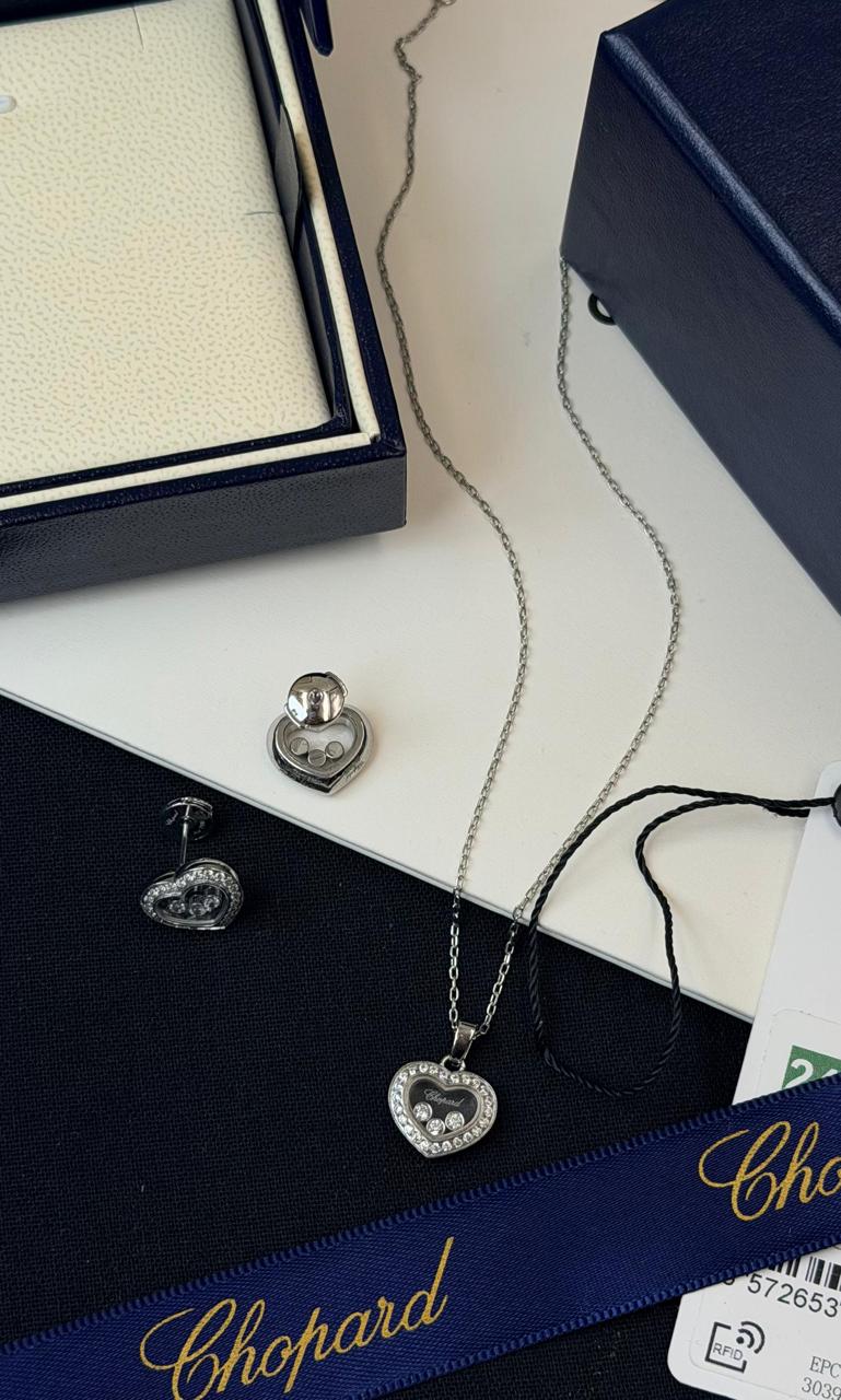 Chopard Happy Diamonds Heart Necklace & Earrings Set — Silver-Tone Design with Floating Diamond Details and Pavé-Set Heart Borders.