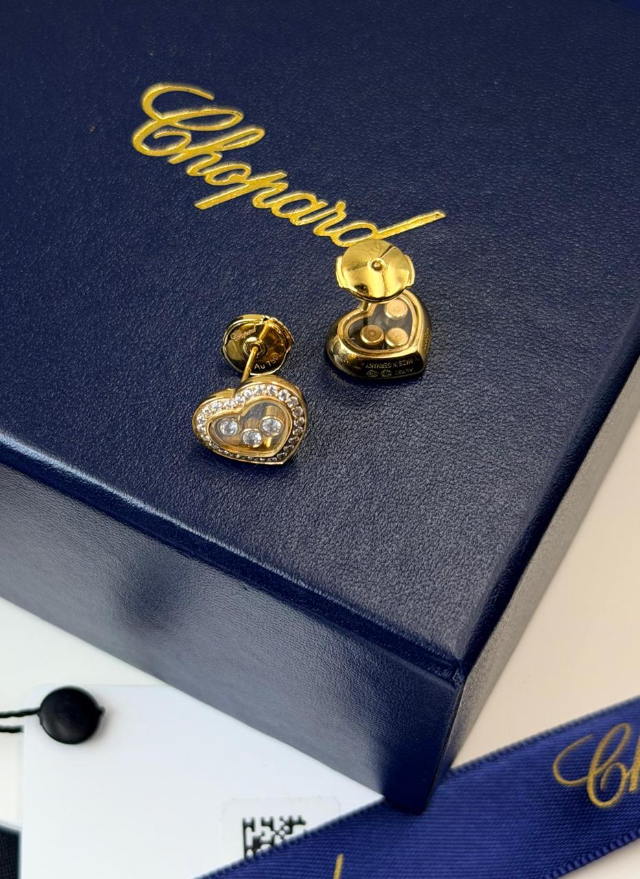 Chopard Happy Diamonds Heart Stud Earrings — White-Tone Metal with Three Floating Stones and Pavé-Set Heart Borders.