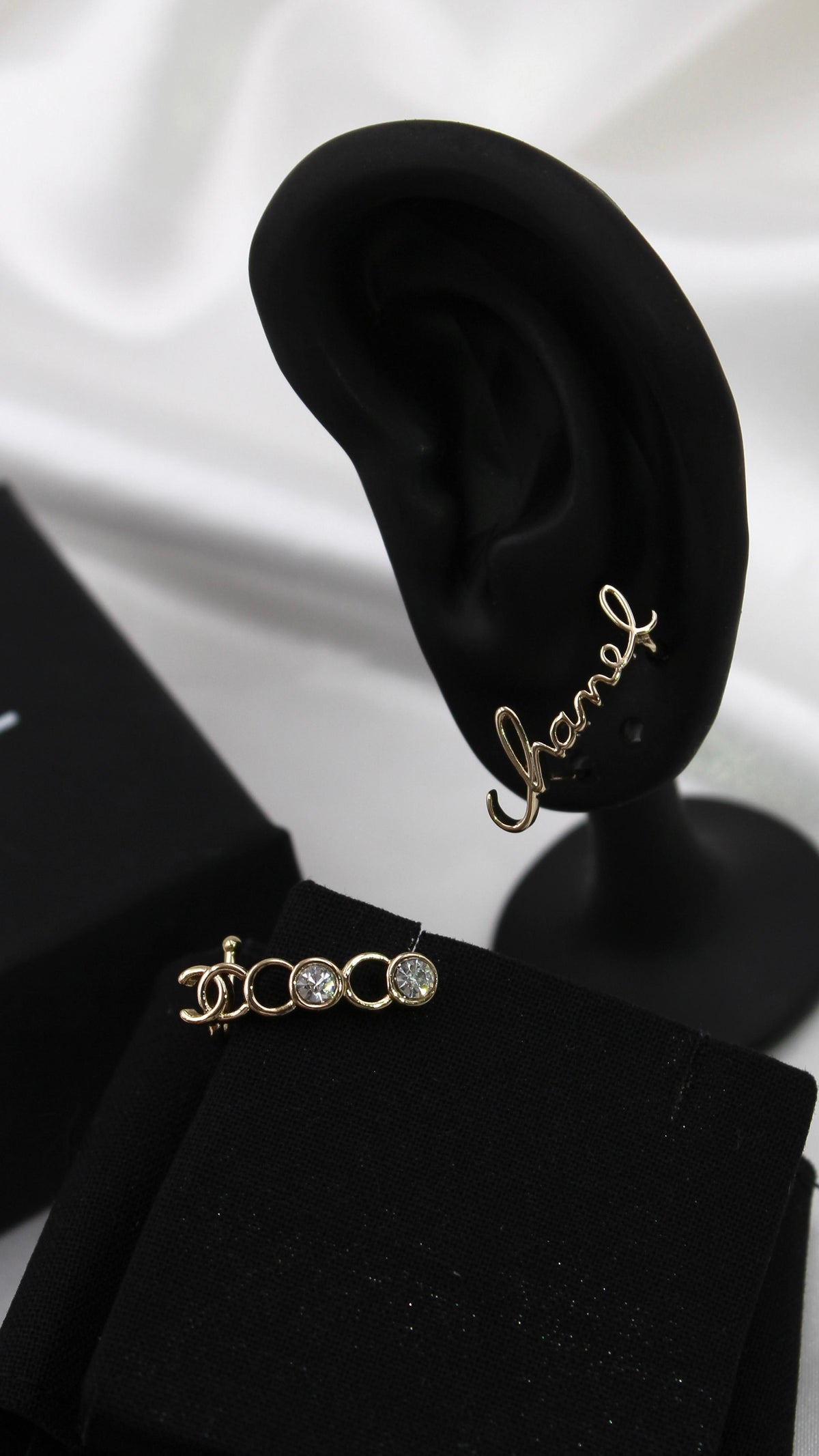CHANEL – Gold Script Logo Earrings