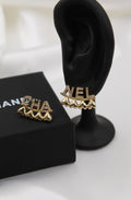CHANEL – Gold Letter Logo Earrings