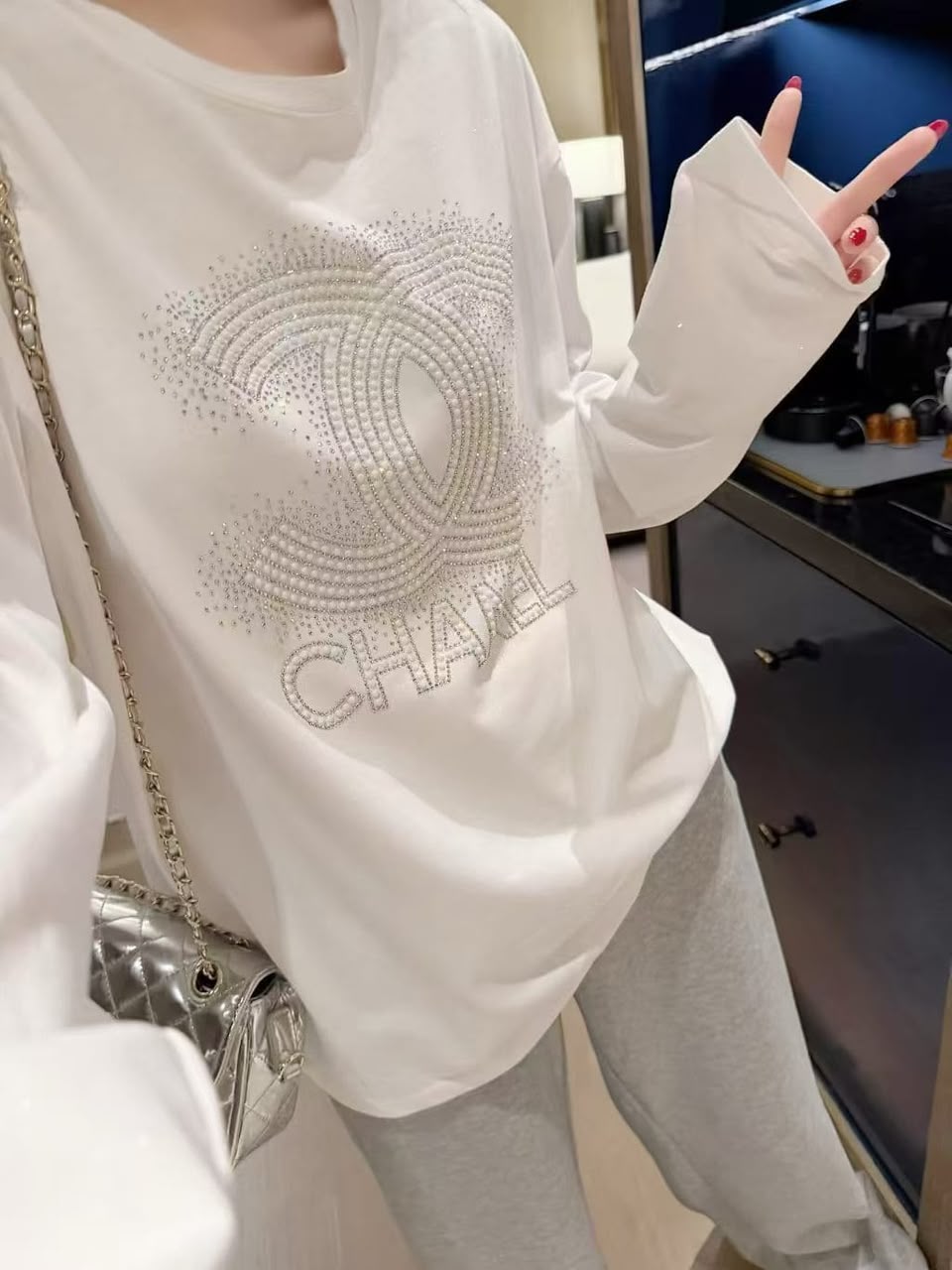 Chanel  A white long-sleeve cotton top 