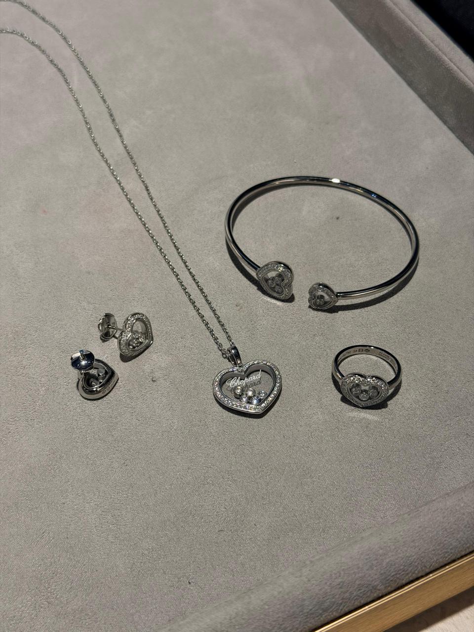 Chopard Happy Diamonds Heart Four-Piece Jewelry Set — -Tone Necklace, Ring, Stud Earrings & Open Cuff Bracelet with Floating Stone Details and Pavé-Set Heart Borders.