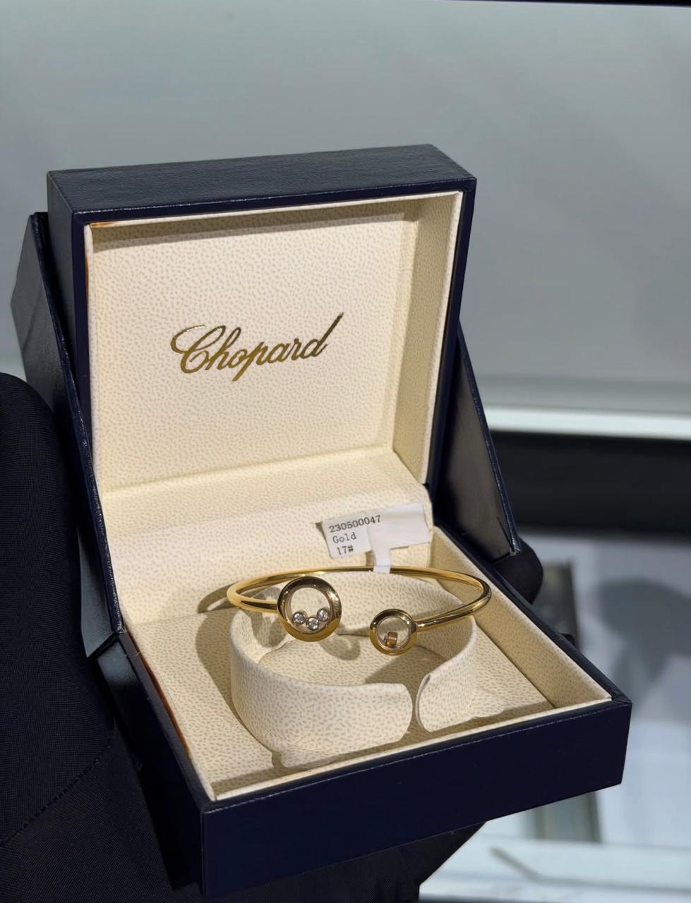 Chopard Happy Diamonds Open Cuff Bracelet — -Tone Metal with Asymmetric Round Motifs and Floating Stone Details.