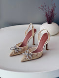 Amina Muaddi Lace Bow Slingback Pumps