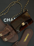 Chanel Mini Evening Bag
Tortoiseshell-patterned plexiglass body and gold-tone chain strap