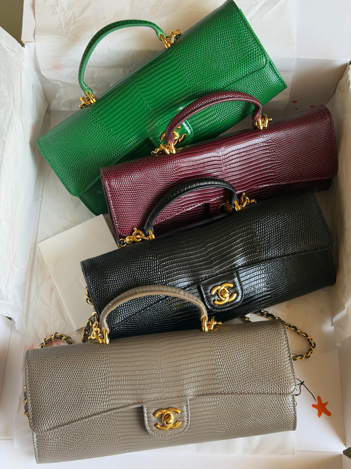 Chanel Clutch with Top Handle in lizard-embossed calfskin